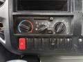 The control panel of a 2015 Hino 195 featuring dials for temperature and fan speed as well as buttons for air conditioning and various functions