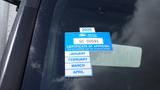 A blue vehicle inspection sticker displaying the year 2025 and showing the months January through April in a list format with a certificate of approval label