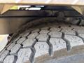 Close-up of a tire from a 2020 Peterbilt 330 showing tread patterns and texture