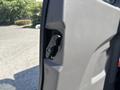 A close-up view of the door handle mechanism on the driver side of a 2025 Ford Transit T-350