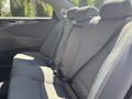A 2014 Hyundai Sonata with gray fabric seats in the rear passenger area featuring seat belts