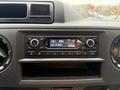 Dashboard of a 2024 Ford E-450 featuring a radio display showing FM station 93.70 MHz and a clock displaying 8:56