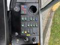Control panel of a 2004 Bombardier SW48 featuring various buttons and switches for operation and functionality