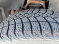 Close-up of a textured tire tread from a 2013 Chevrolet Silverado 1500 showing detailed patterns and grooves designed for traction