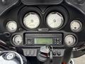 Close-up of the dashboard of a 2009 Harley-Davidson Road King featuring speedometer fuel gauge and audio controls
