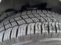 Close-up of a tire tread showing deep grooves and patterns on a 2019 Chevrolet Express tire