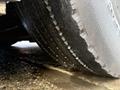 Close-up of a worn tire on a 2016 Grande West Vicinity showing significant tread wear and visible damage to the rubber surface