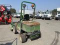 A 2012 John Deere 1445 Lawn Mower with a green body and yellow accents features a rotatable light on the top and is designed for mowing grass in commercial settings