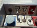 A control panel with multiple switches and buttons labeled for platform operation emergency power and master control