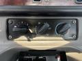 Control panel with three knobs for airflow and temperature settings in a 2010 Freightliner M2 106 truck