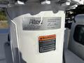 Close-up of a 2006 Freightliner M2 106 vehicle inspection tag with details including Altec information and warning about improper maintenance hazard