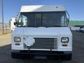 Front view of a white 2012 Ford Econoline with a flat front and a large windshield featuring a delivery truck design