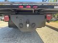 A 2011 International 4300 truck's rear view showing the trailer hitch with lights on either side and a coupling mechanism in the center