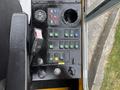 Control panel of a 2004 Bombardier SW48 featuring various switches and gauges for operation and monitoring functions