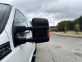 A 2013 Ford F-250 SD with a prominent side mirror visible in the foreground