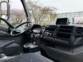 Interior of a 2015 Hino 195 showing the dashboard steering wheel gear shift and control panel