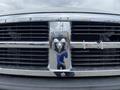 Chrome grille of a 2011 Dodge Ram 5500 featuring the Ram head logo prominently in the center with visible front grille openings