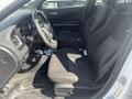 Interior view of a 2017 Dodge Charger showing two front seats in black fabric with a steering wheel and dashboard visible