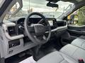 Interior of a 2023 Ford F-450 Super Duty showing the steering wheel dashboard and seating area with a modern design and control features
