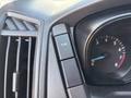 The dashboard of a 2016 Ford Transit 150 showing a button labeled TCS and a speedometer with a needle pointing to a low speed