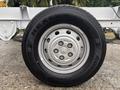 A 2023 RAM Promaster 3500 tire showing a silver wheel and a Nexen tire with a tread pattern designed for durability and performance