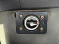 A black rotary switch mounted on a panel with an "OFF" position indicated and red markers showing different settings