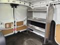 A 2017 Ford Transit Connect with a metal shelving unit installed in the cargo area