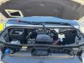 Engine compartment of a 2024 Mercedes-Benz Sprinter 2500 showing various mechanical components and fluid reservoirs