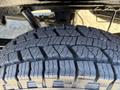 Close-up of a tread pattern on a 2024 Mercedes-Benz Sprinter 2500 tire showcasing deep grooves and durable rubber composition