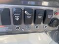 Close-up of a control panel featuring five black switches labeled Blower Interior Light Docking Light Water Pump