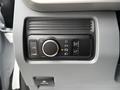 Control panel featuring buttons and a dial for the 2023 Ford F-450 Super Duty with light settings and other functionalities