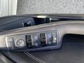Close-up of a control panel for window and mirror adjustments in a 2014 Mercedes-Benz CLA-Class vehicle