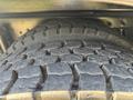 Close-up of a heavily treaded tire showing deep grooves and wear patterns typical of a 2013 International 7500 vehicle