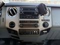 Dashboard of a 2014 Ford F-550 featuring various control buttons a radio and air vents