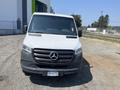 A 2022 Mercedes-Benz Sprinter van with a white exterior and a prominent black grille featuring the Mercedes-Benz logo