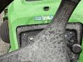 2009 John Deere 2653B Precision Diesel Mower with a wet steering wheel and control panel visible from the operator's perspective