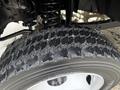 Close-up of a tire on a 2012 Ford F-550 showcasing the tread pattern and wheel rim details