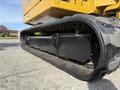 A close-up view of a rubber track from a 2022 Caterpillar 306 excavator showing its tread and undercarriage design