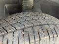 A close-up view of a tire on a 2022 Mercedes-Benz Sprinter showcasing the tread design and surface details