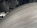 Close-up of a tire from a 2019 Isuzu NRR showing tread wear and surface details