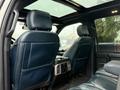 Interior of a 2018 Ford F-150 showing leather seats and dashboard with a panoramic sunroof visible above