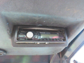 A Panasonic radio control panel mounted in the cab of a 2013 Toro Grounds Master 5910 equipped with various buttons and a digital display