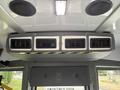 The interior ceiling of a 2020 Chevrolet Express showing four air vents and two speakers