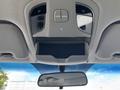 Interior view of a 2014 Hyundai Sonata overhead console featuring controls for lights and a storage compartment