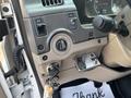 The dashboard controls of a 2006 Sterling Acterra with a key in the ignition and various switches and knobs for adjusting settings