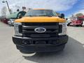 A bright yellow 2017 Ford F-250 SD truck with a prominent Ford emblem on the grille and "SUPER DUTY" embossed on the hood