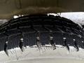 Close-up of a tire tread on a 2023 Ford Transit showcasing its deep grooves and patterns designed for traction and stability