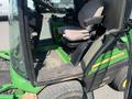 A 2016 John Deere 1585 Terrain Cut mower with a green and yellow exterior featuring a driver's seat and a floor covered in rubber matting