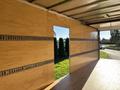 A 2022 Lion Lion6 truck with an open back revealing a wooden interior and a space that leads outside