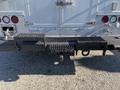 Rear view of a 2008 International 4400 showing the hitch assembly with various attachment points and a textured surface